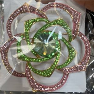 Large flower brooch set in gold tone with pink and green rhinestones